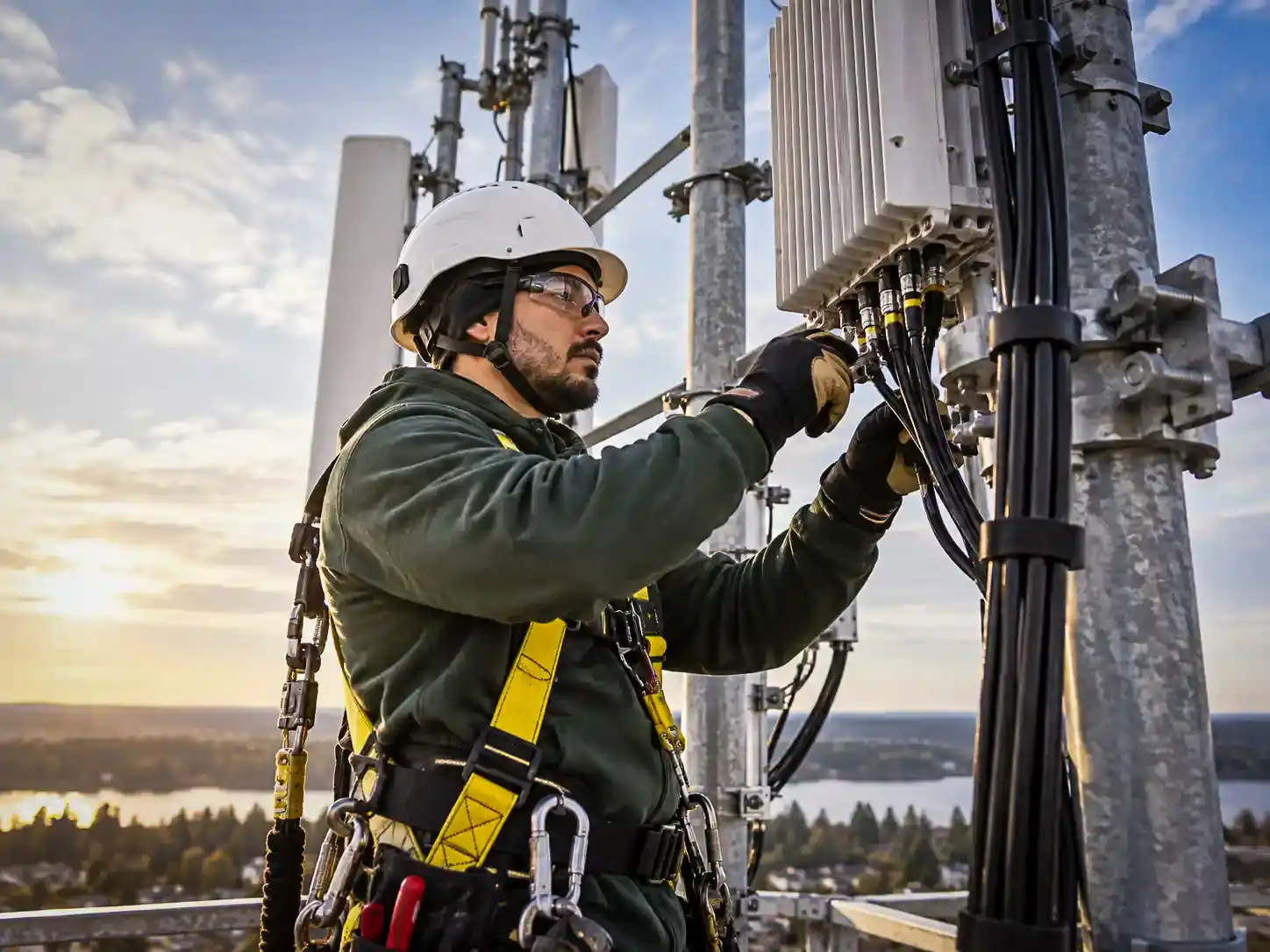 Telecom field worker secured to a communications tower